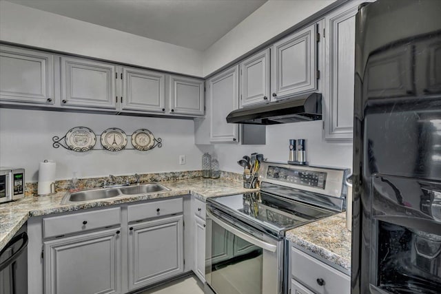 kitchen featuring appliances with stainless steel finishes, gray cabinets, and sink