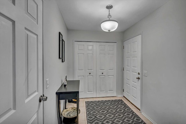 doorway featuring light tile patterned floors