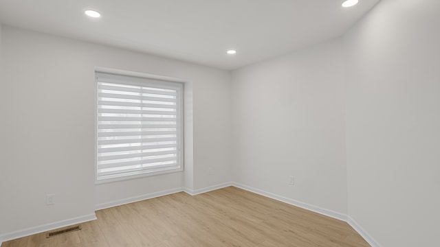 unfurnished room featuring light hardwood / wood-style flooring