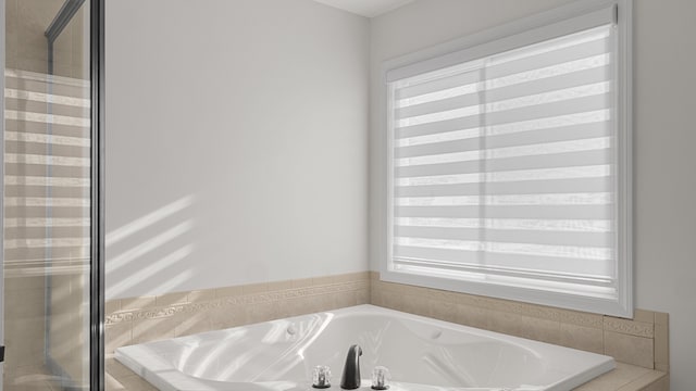 bathroom with tiled tub