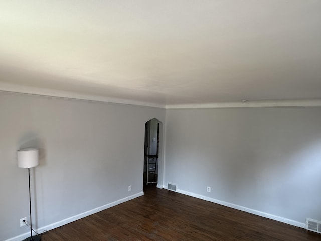 spare room featuring dark hardwood / wood-style floors