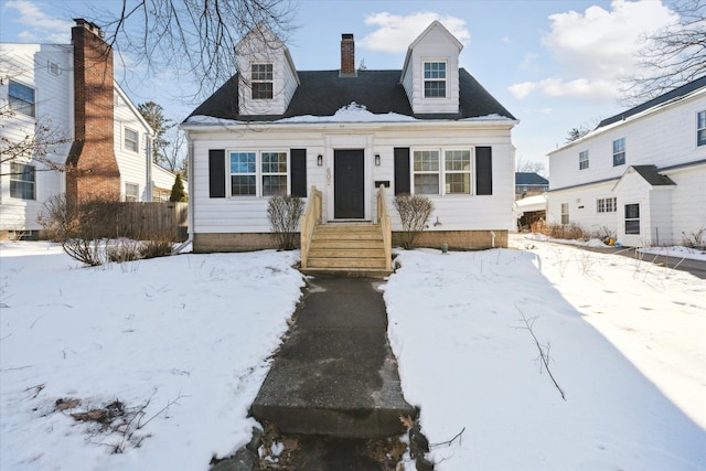 view of front of home featuring a chimney