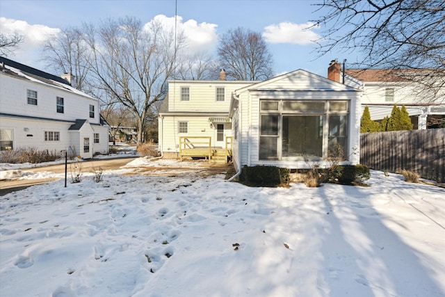 view of snow covered house