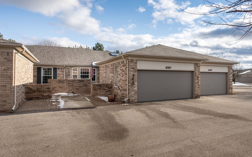 single story home featuring a garage