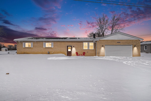 ranch-style home featuring a garage