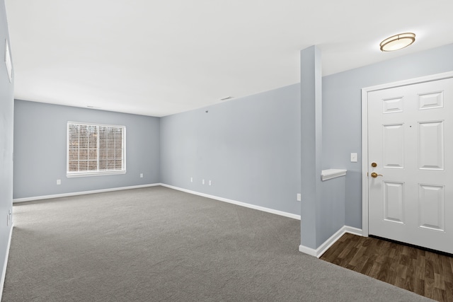 view of carpeted foyer entrance