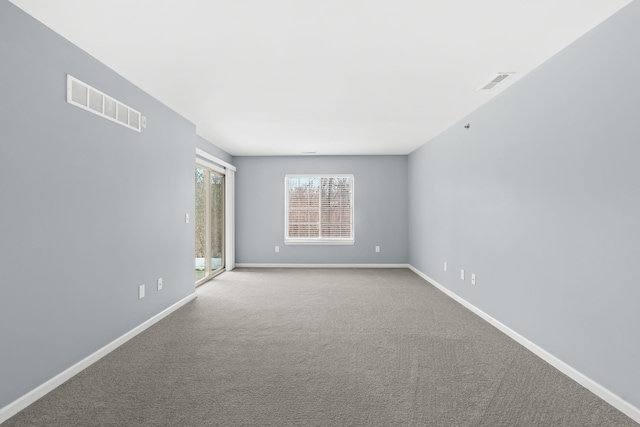 unfurnished room featuring carpet