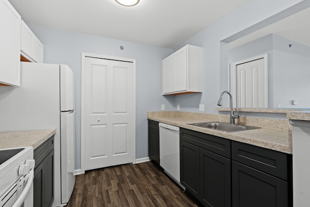 kitchen featuring dark hardwood / wood-style floors, sink, white cabinets, and white appliances