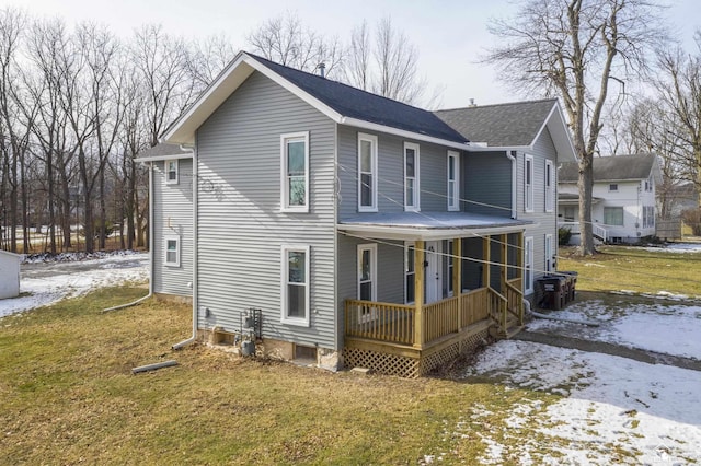 exterior space with a porch and a lawn