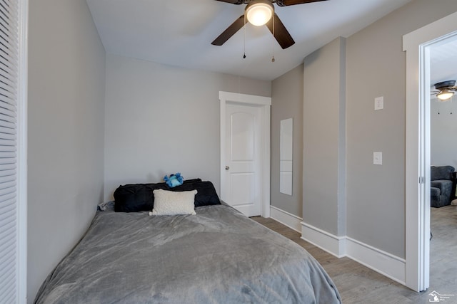 bedroom featuring ceiling fan and light hardwood / wood-style flooring