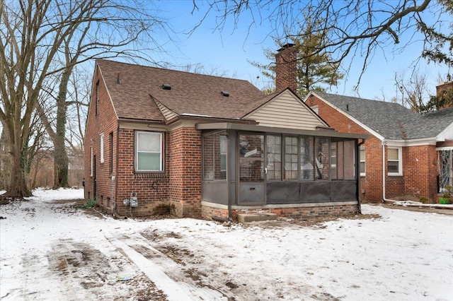 exterior space featuring a sunroom