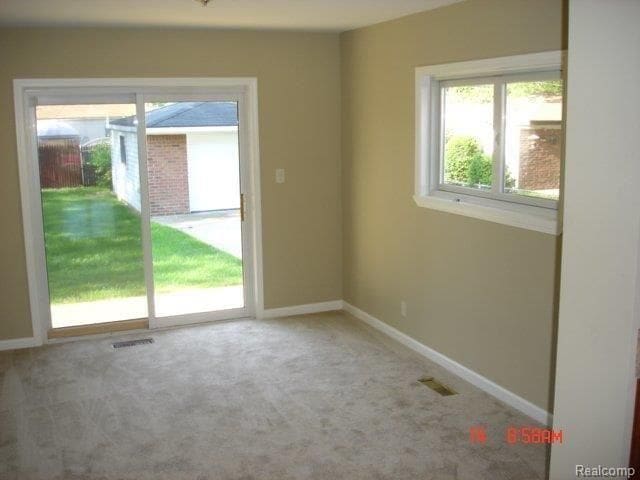 unfurnished room featuring carpet floors