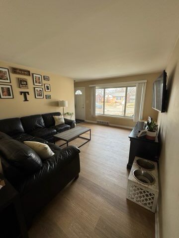 living room with hardwood / wood-style floors