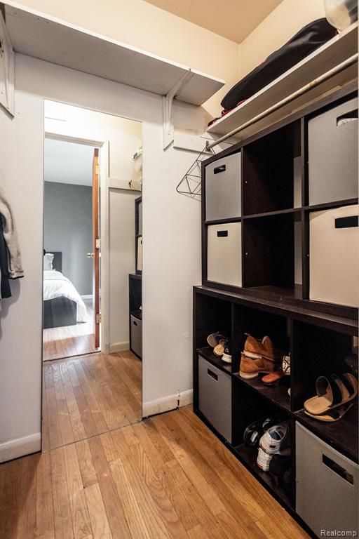 spacious closet featuring light hardwood / wood-style flooring