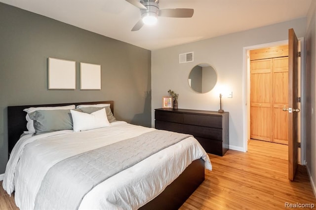 bedroom with ceiling fan and light hardwood / wood-style flooring