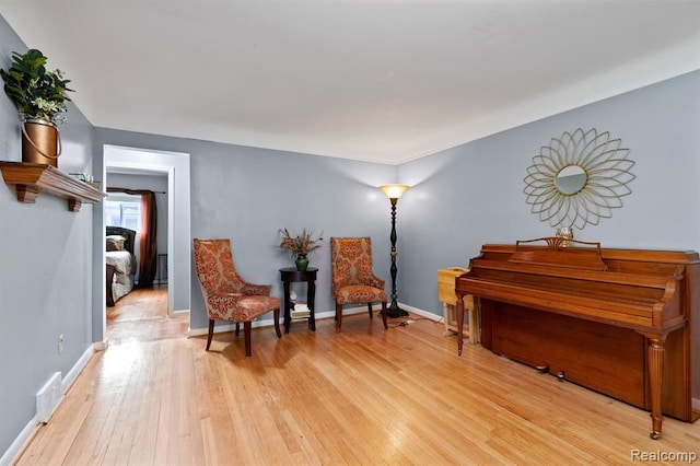 living area with light hardwood / wood-style floors