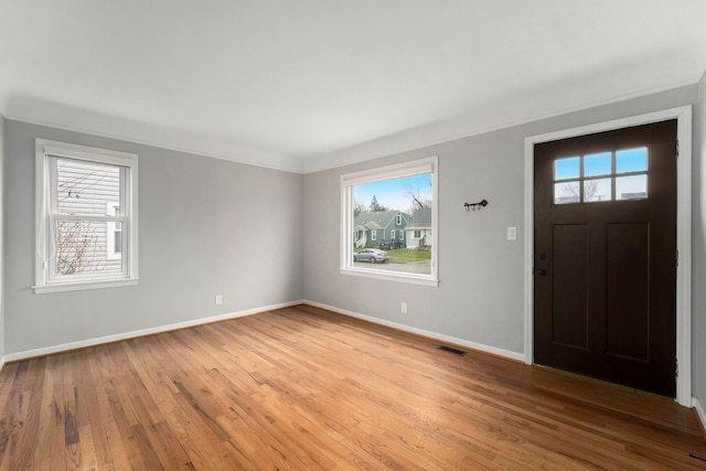 foyer with a healthy amount of sunlight and light wood-type flooring