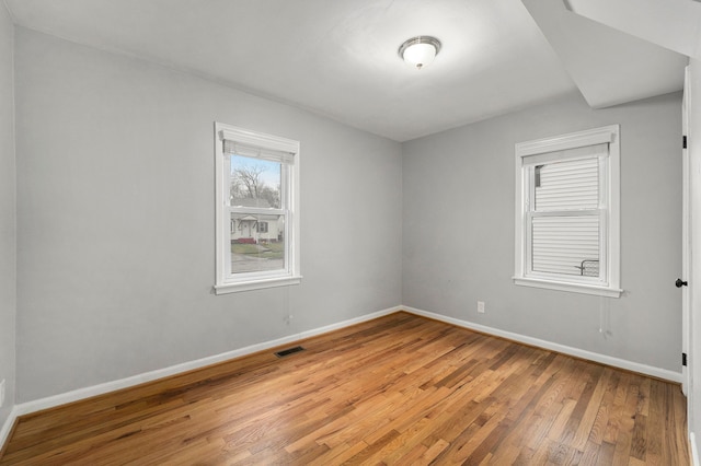 empty room with wood-type flooring