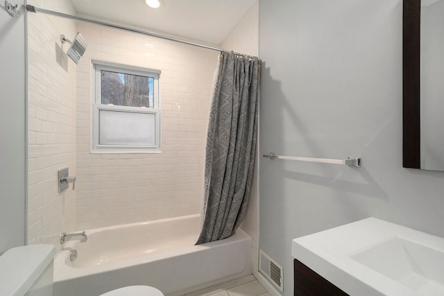 full bathroom featuring tile patterned flooring, vanity, toilet, and shower / bath combo