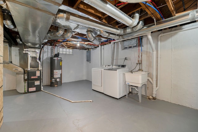 basement with gas water heater, separate washer and dryer, sink, and heating unit