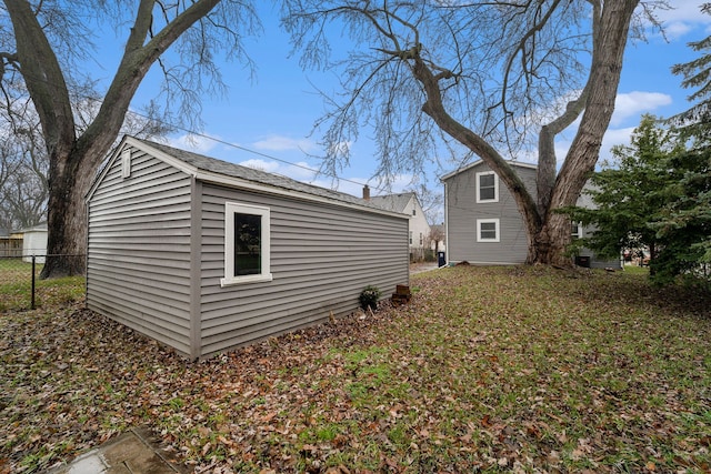 view of property exterior featuring an outbuilding