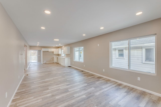 unfurnished living room with light hardwood / wood-style floors