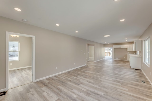 unfurnished living room with light hardwood / wood-style flooring