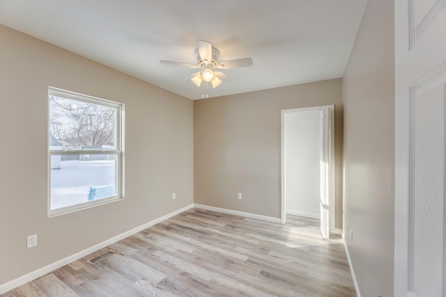 unfurnished room featuring ceiling fan and light wood-type flooring