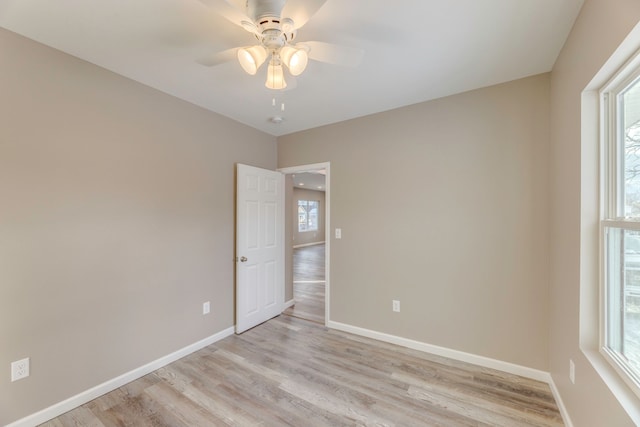 unfurnished room with ceiling fan and light hardwood / wood-style floors