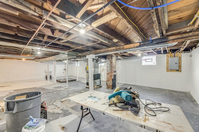 basement with heating unit and electric panel