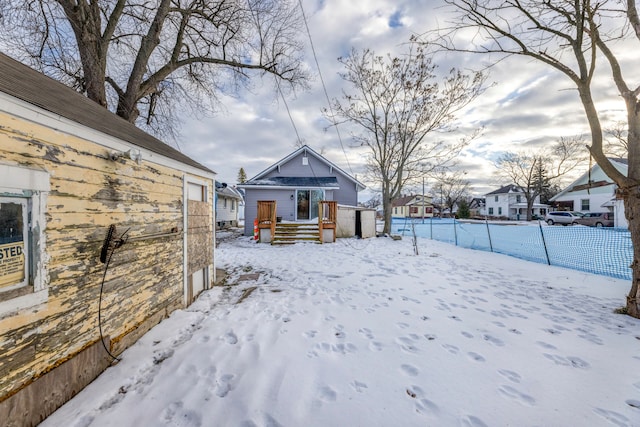 view of yard layered in snow