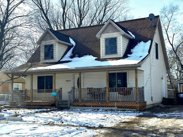 new england style home with covered porch