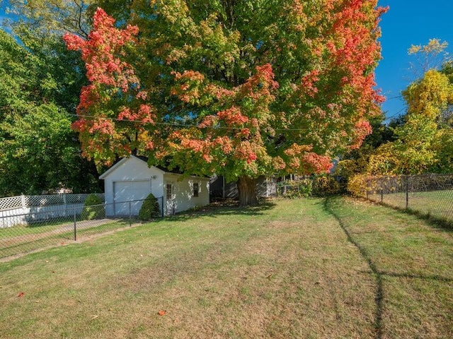 view of yard with an outbuilding and a garage