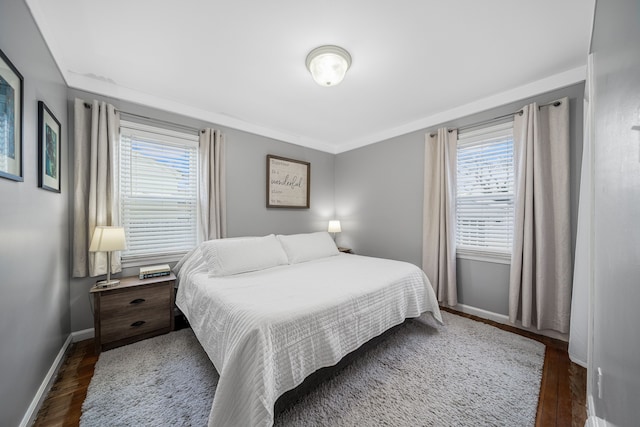 bedroom featuring dark hardwood / wood-style flooring