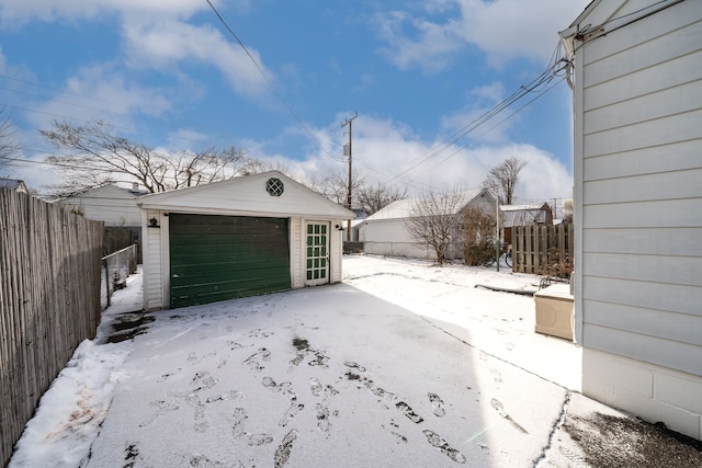 view of snow covered garage