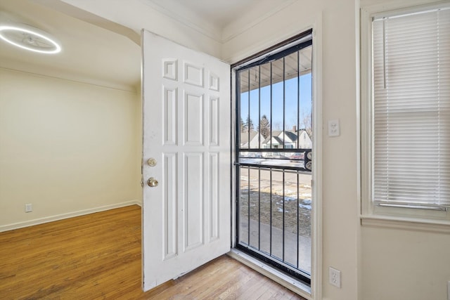 doorway to outside featuring light wood-type flooring