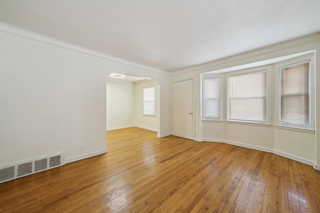 spare room with wood-type flooring