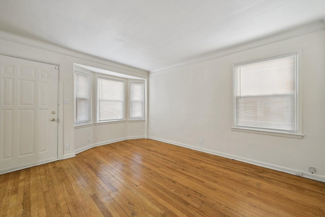 unfurnished room with light wood-type flooring