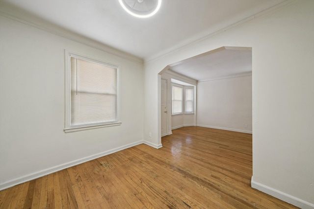 interior space featuring ornamental molding and wood-type flooring