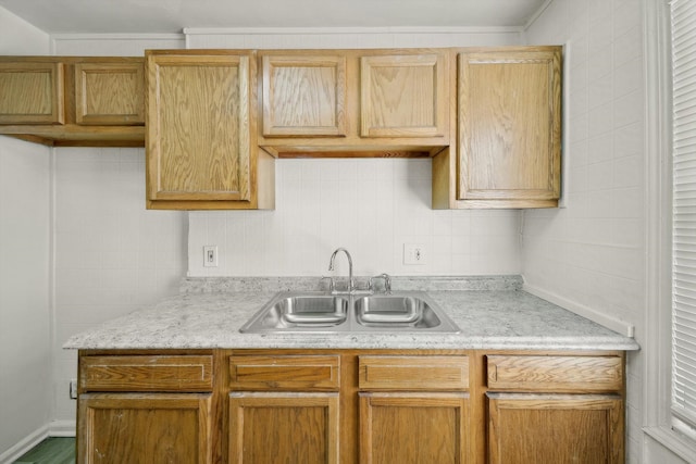 kitchen featuring sink and backsplash