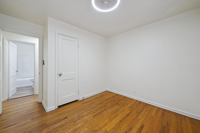 spare room with light wood-type flooring