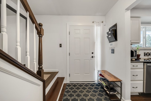 foyer with dark hardwood / wood-style flooring