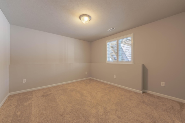 unfurnished room featuring carpet floors