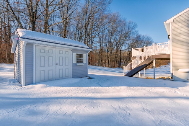 view of snow covered garage