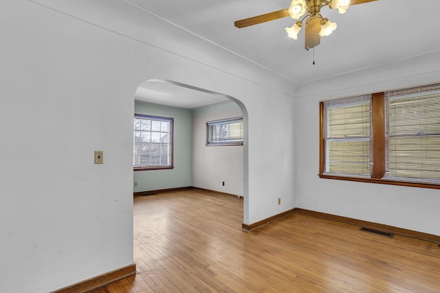 spare room with ceiling fan and light hardwood / wood-style flooring