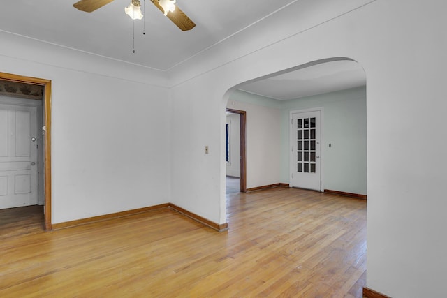 spare room featuring wood-type flooring and ceiling fan