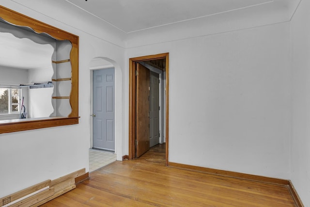 unfurnished room with light wood-type flooring