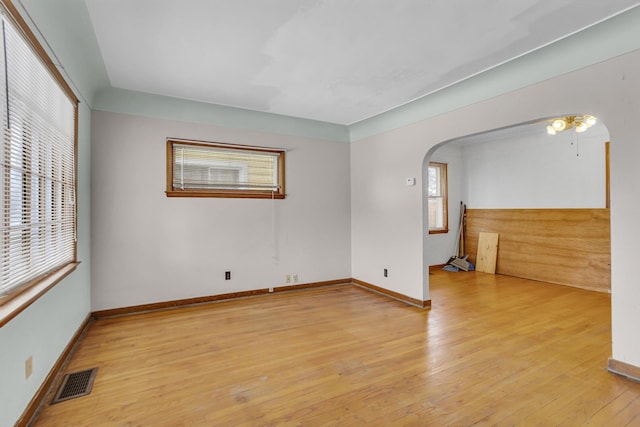 empty room featuring plenty of natural light and light wood-type flooring