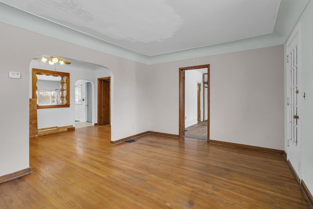 spare room with hardwood / wood-style floors