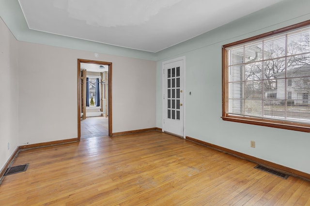 unfurnished room with light hardwood / wood-style floors